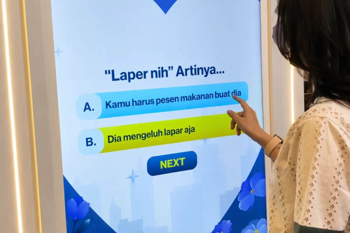 Couples playing the NHPV Quiz web app experience at the event venue