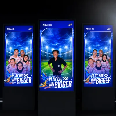 Three-panel real-time LED display showing football-themed photobooth results for Allianz ASN Kick Off Meeting 2026